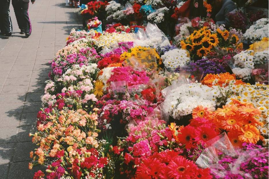 Florist arranging wedding bouquet
